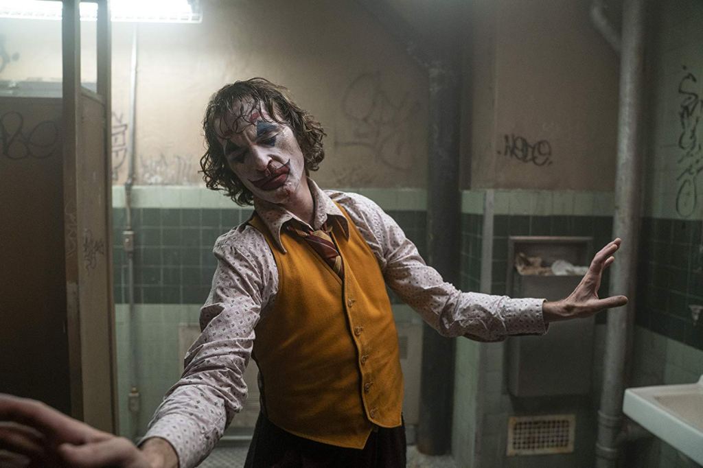 Joker dances in the bathroom.
