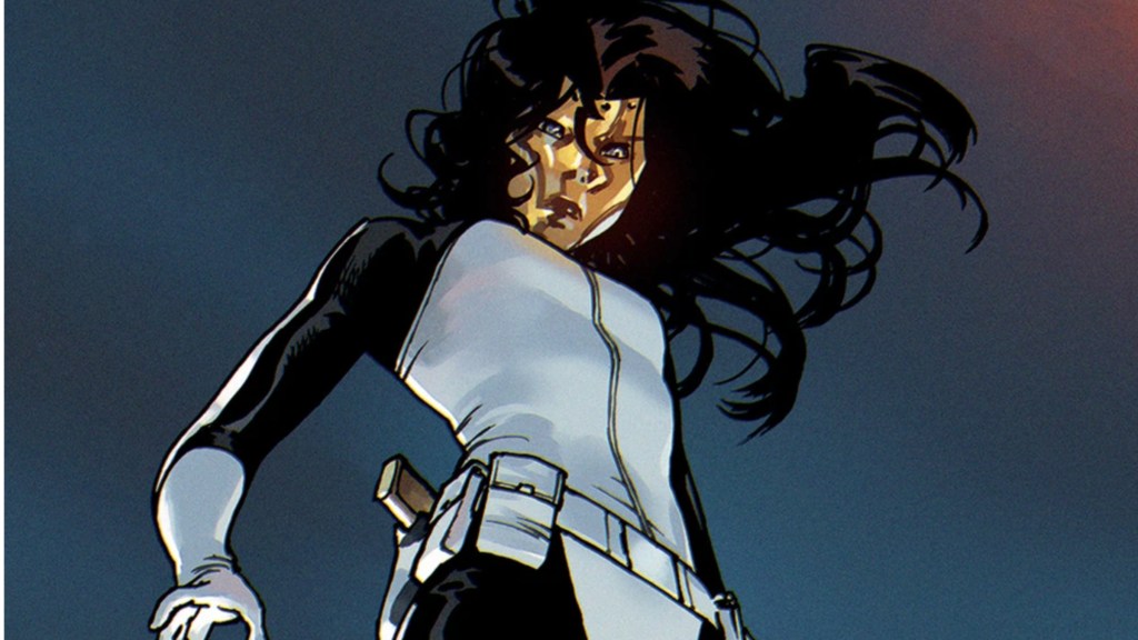 Madame Masque looking down, her hair in the wind